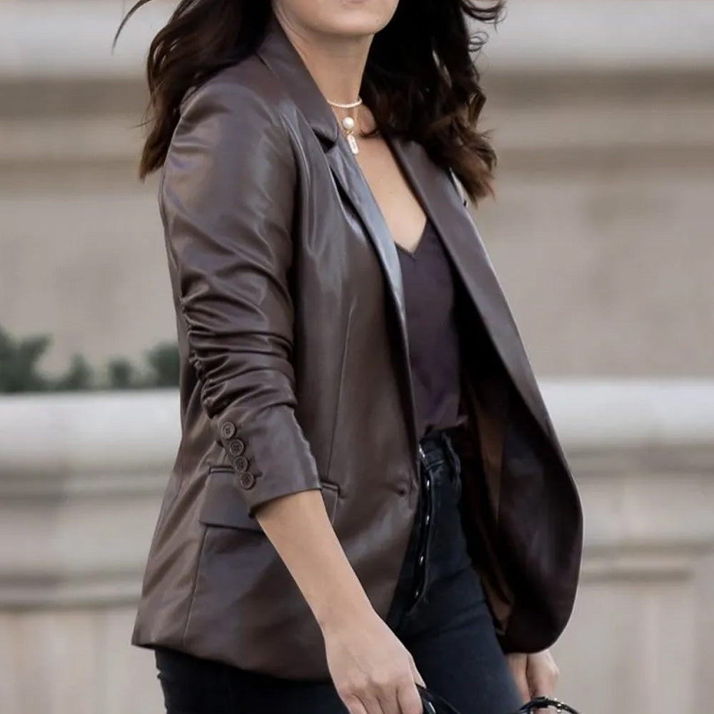 Woman wearing a stylish blazer leather jacket - right side view