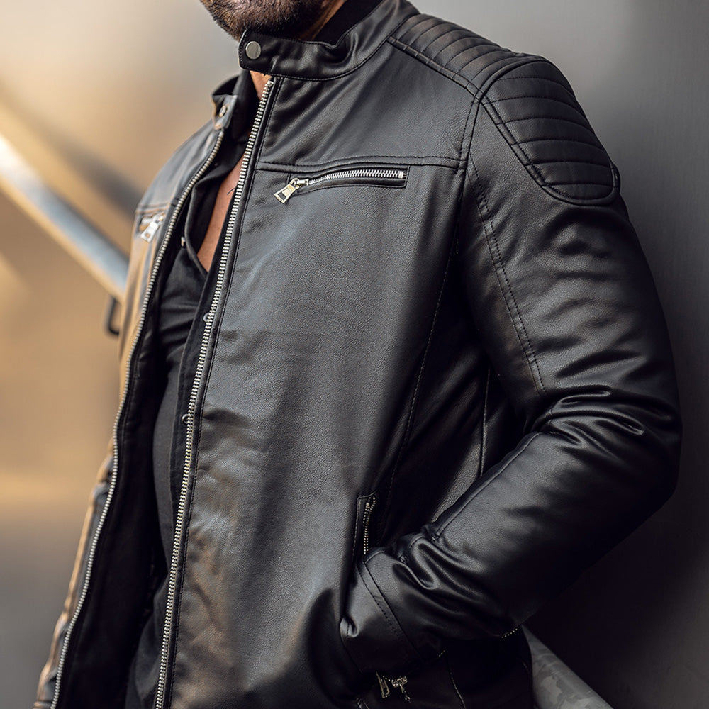 Man wearing a sleek black leather biker jacket.