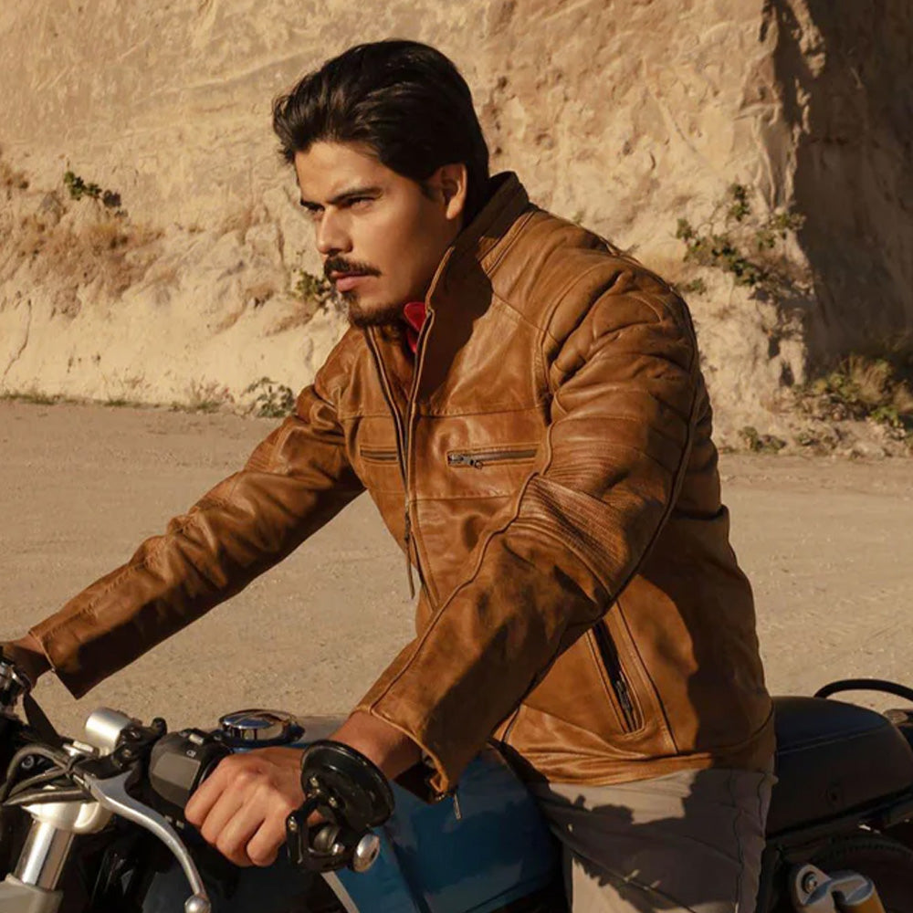 A man wearing a brown leather motorcycle jacket